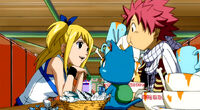 Lucy treating Natsu and Happy to dinner